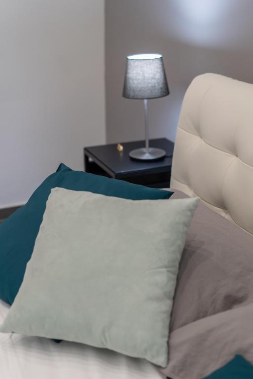 Posteľ alebo postele v izbe v ubytovaní Doria Suites Napoli