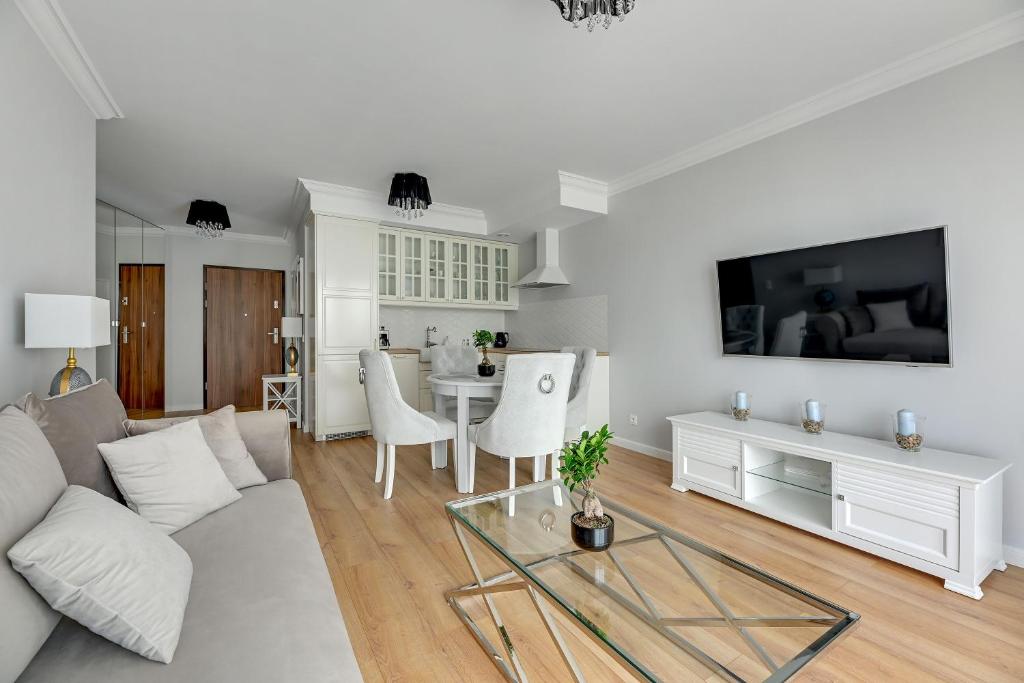 Televízia a/alebo spoločenská miestnosť v ubytovaní Comfort Apartments Dolny Sopot