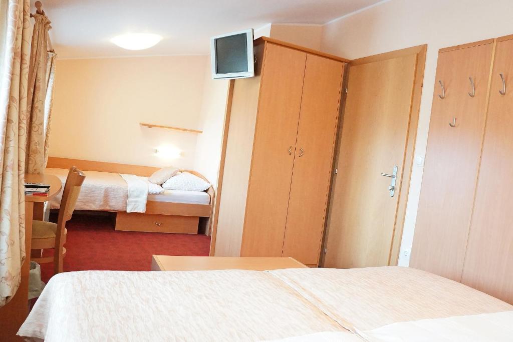 Postel nebo postele na pokoji v ubytování Guest House Pri Gondoli