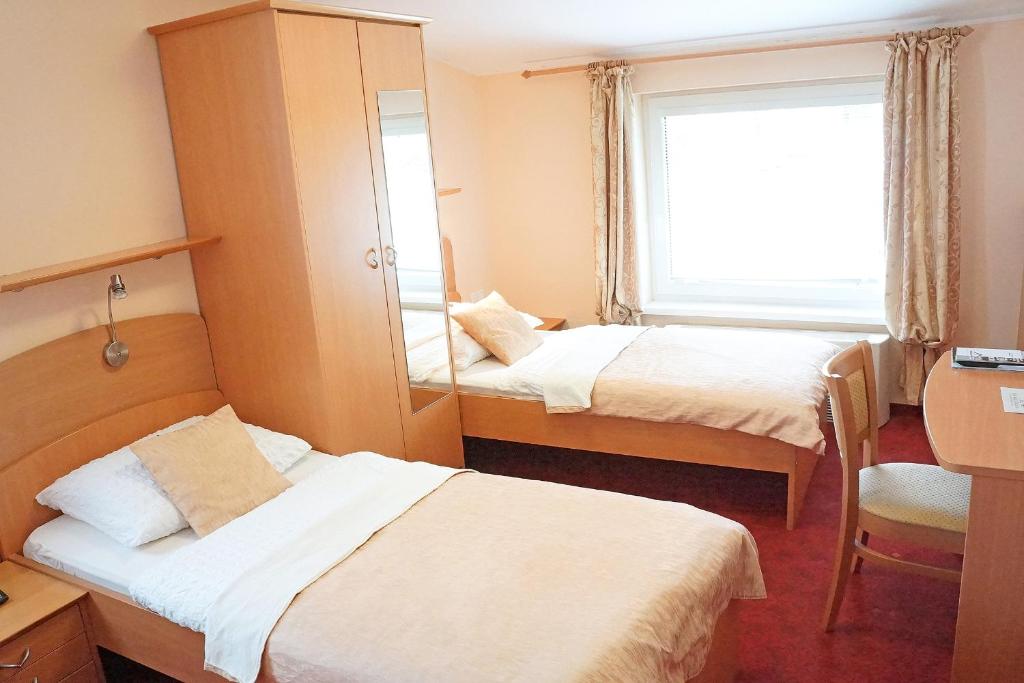 Postel nebo postele na pokoji v ubytování Guest House Pri Gondoli