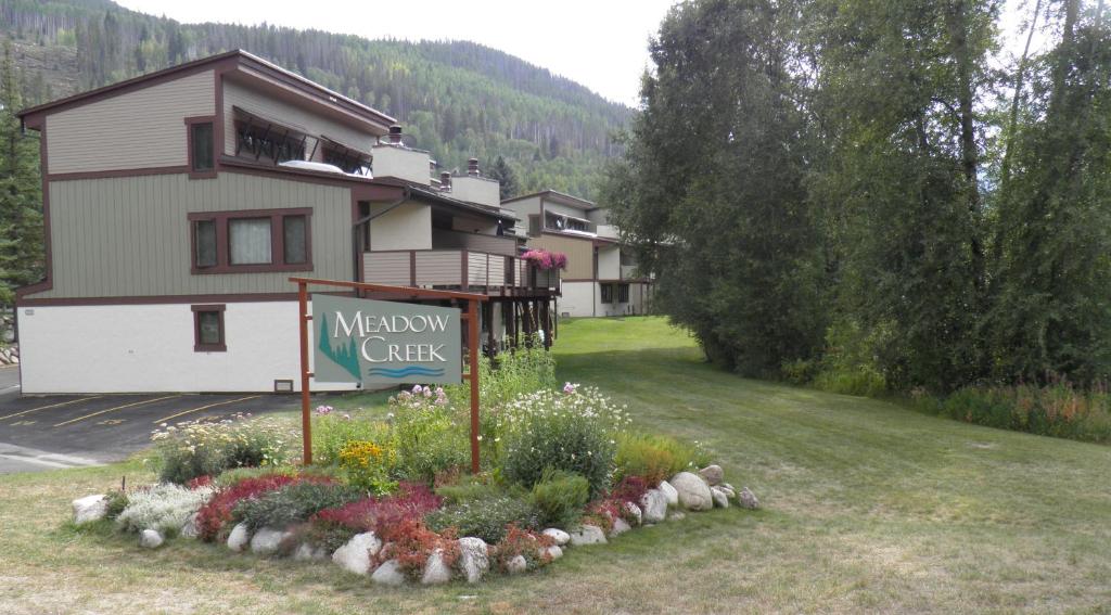 a meadow city sign in front of a house at Meadow Creek Townhome by Vail Realty in Vail