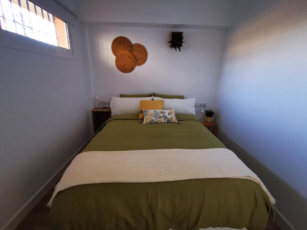 A bed or beds in a room at Lido Beachfront