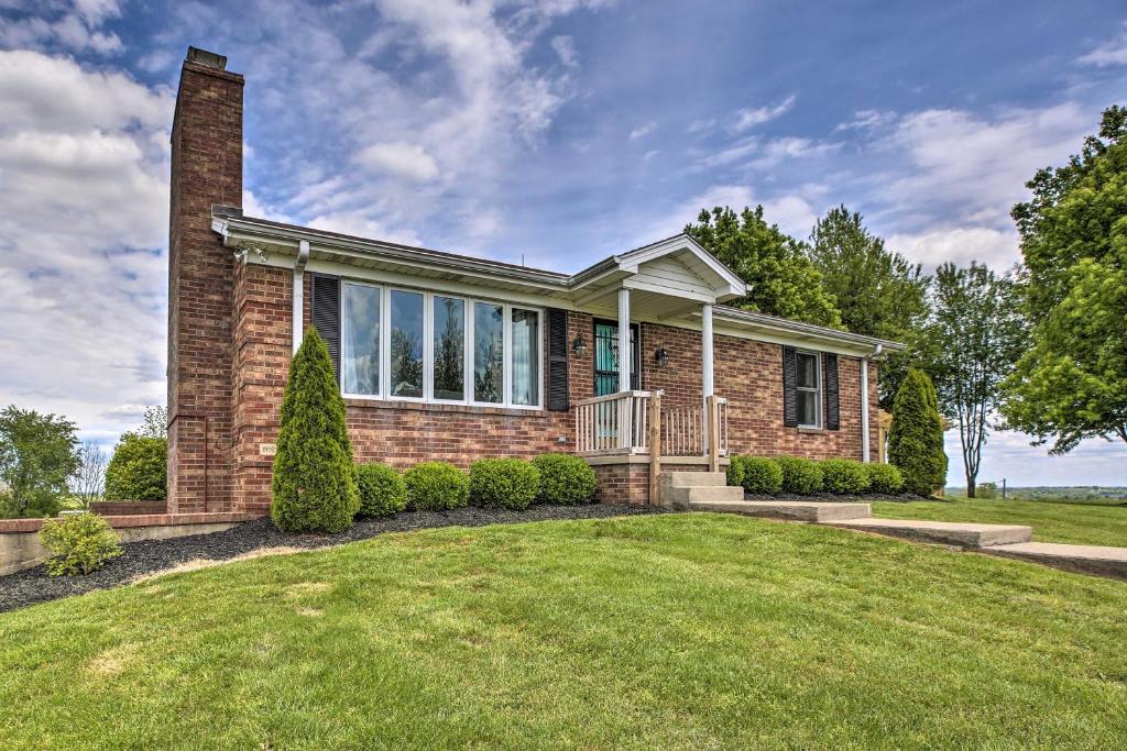 a brick house with a lawn in front of it at Countryside House with Amazing Views of 5 Counties! in Danville