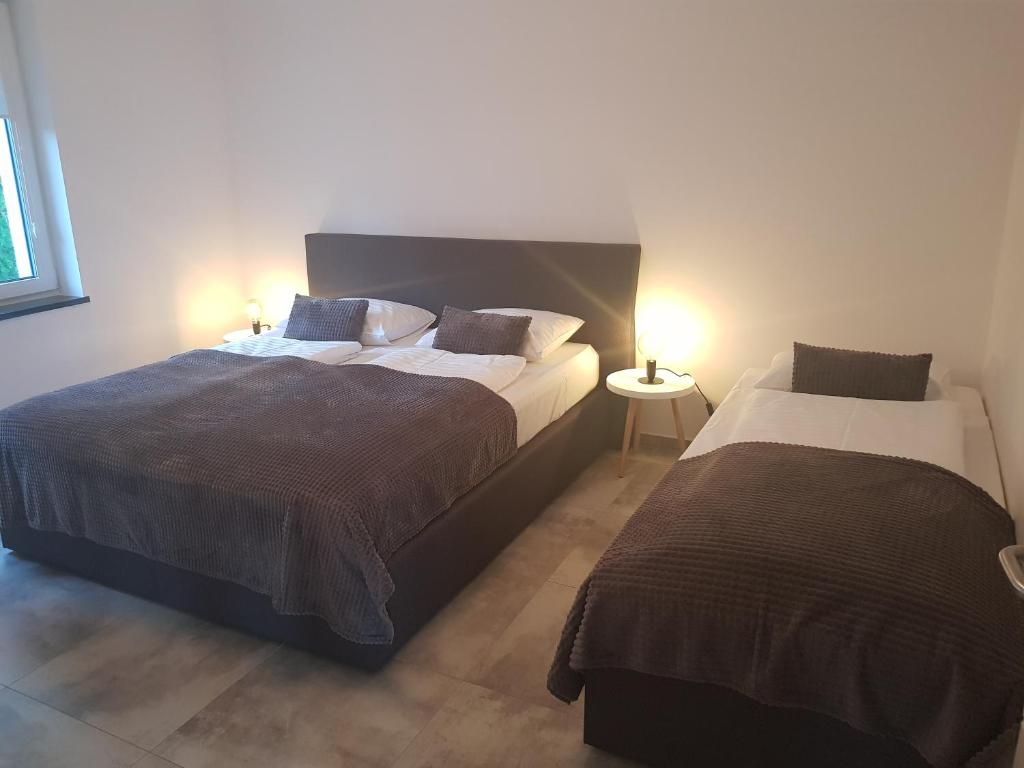 Posteľ alebo postele v izbe v ubytovaní Apartamenty KADO