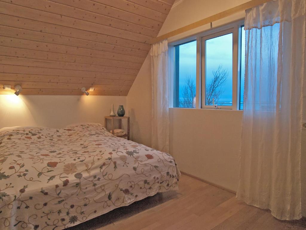 Postel nebo postele na pokoji v ubytování Skyrhusid HI Hostel