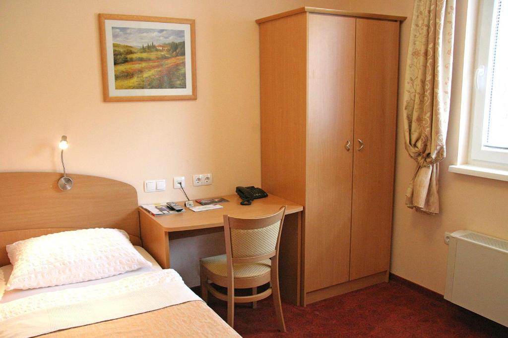 Postel nebo postele na pokoji v ubytování Guest House Pri Gondoli