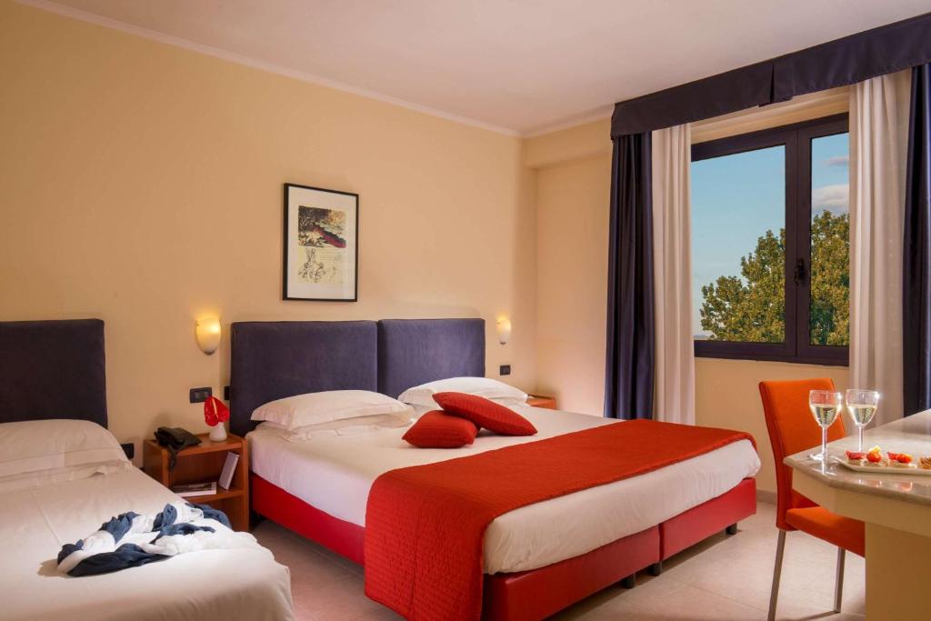 Postel nebo postele na pokoji v ubytování Best Western Blu Hotel Roma