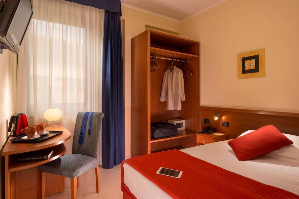 Postel nebo postele na pokoji v ubytování Best Western Blu Hotel Roma