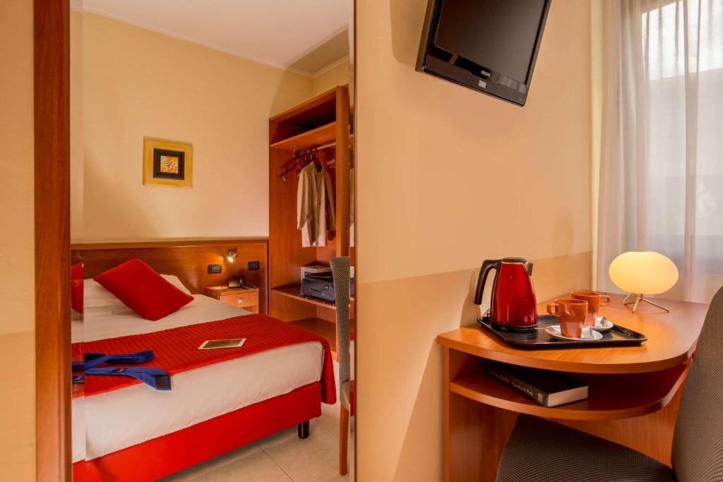 Postel nebo postele na pokoji v ubytování Best Western Blu Hotel Roma