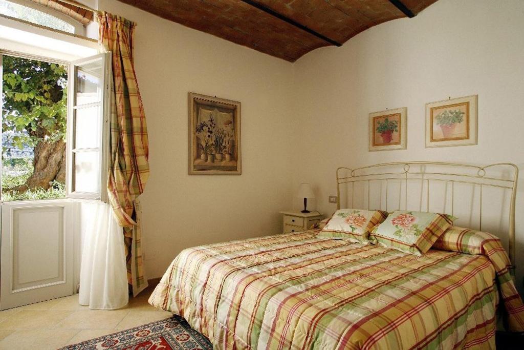 Posteľ alebo postele v izbe v ubytovaní Villa Pian De Noci - Tenuta del Palagio