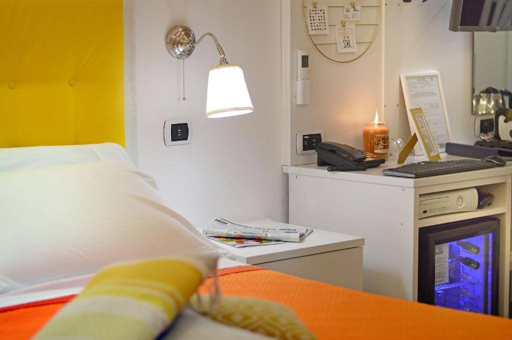 Postel nebo postele na pokoji v ubytování B&B Sorrento Central