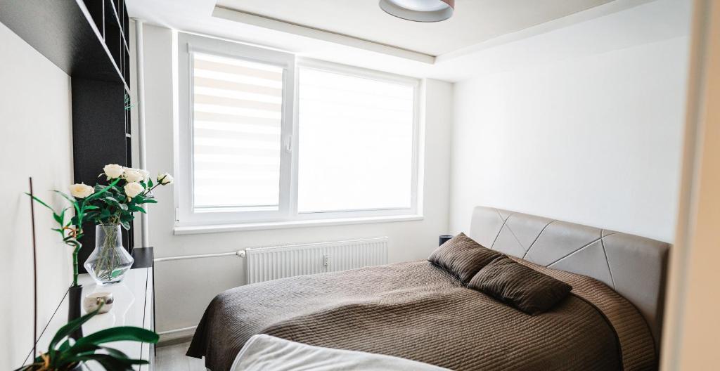 A bed or beds in a room at AH Považská