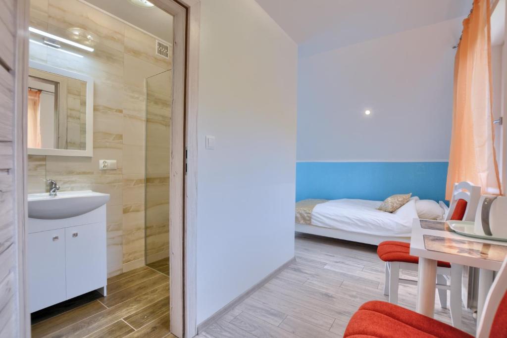 Postel nebo postele na pokoji v ubytování Jaworina- Apartamenty, Domki i Pokoje