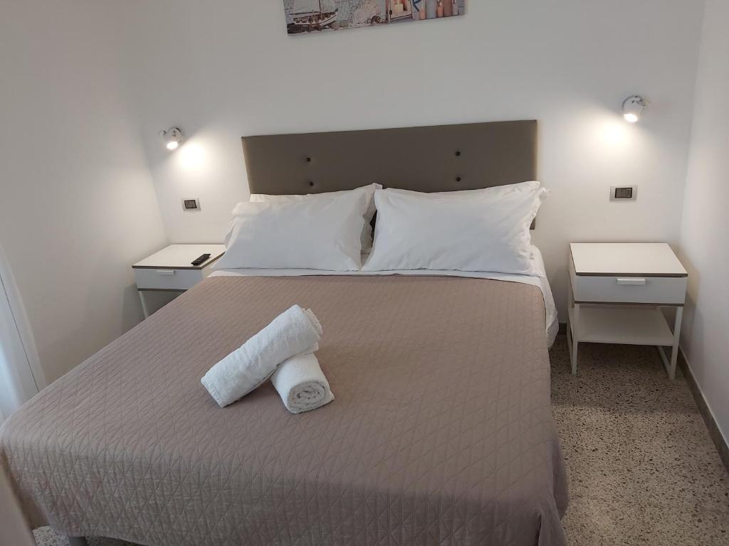 Postel nebo postele na pokoji v ubytování Hotel 21 Riccione