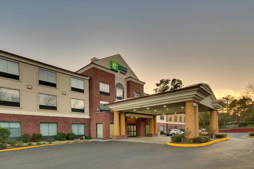 a rendering of a hotel with a parking lot at Holiday Inn Express & Suites Laurel, an IHG Hotel in Laurel