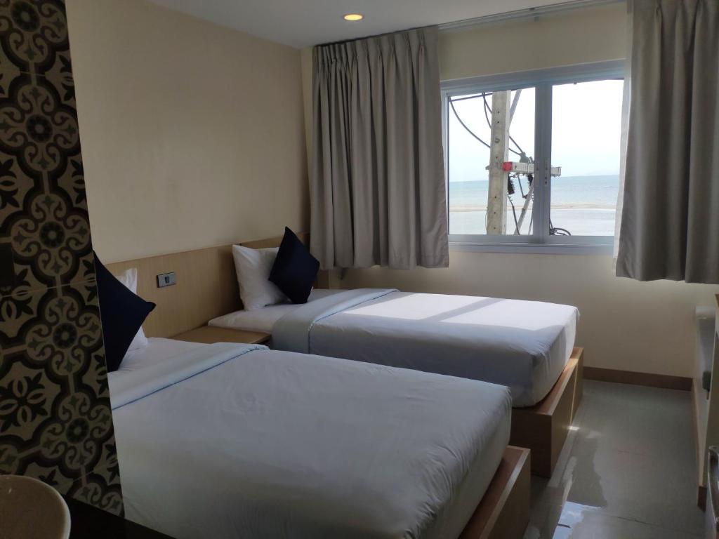 Postel nebo postele na pokoji v ubytování Stay Inn Nathon Samui
