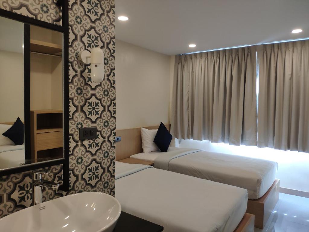 Postel nebo postele na pokoji v ubytování Stay Inn Nathon Samui
