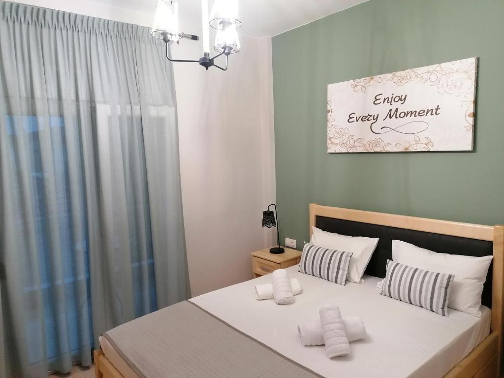 A bed or beds in a room at Green Island Residence