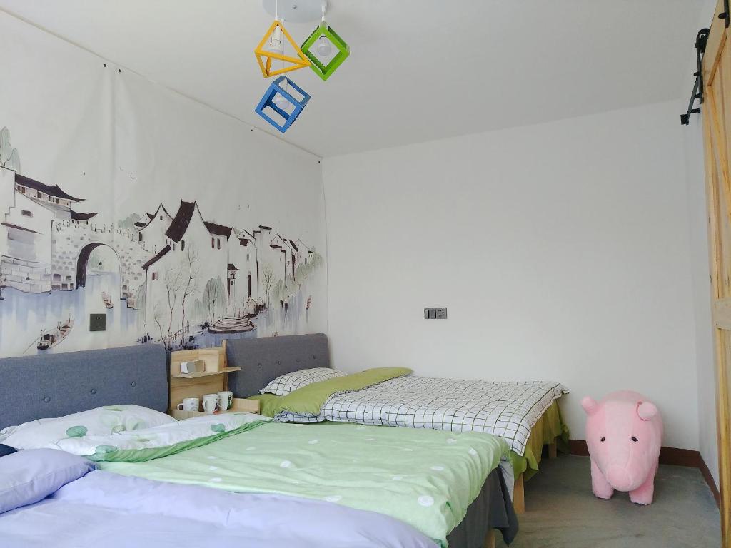 Postel nebo postele na pokoji v ubytování Air Cloud Guesthouse