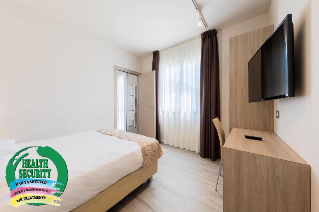 Televízia a/alebo spoločenská miestnosť v ubytovaní Hotel Delfino Venezia Mestre
