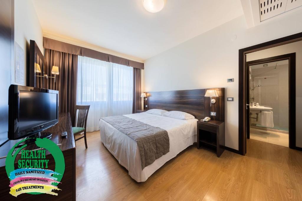 Posteľ alebo postele v izbe v ubytovaní Hotel Delfino Venezia Mestre