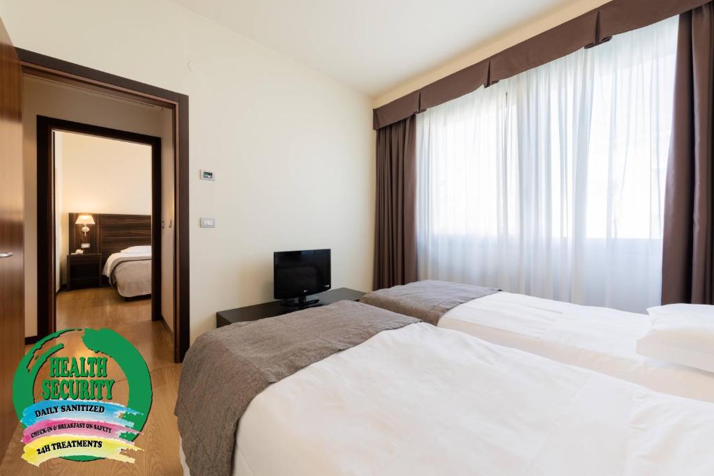 Posteľ alebo postele v izbe v ubytovaní Hotel Delfino Venezia Mestre