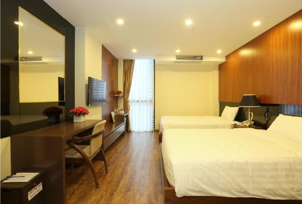 Postel nebo postele na pokoji v ubytování Au Viet Hotel