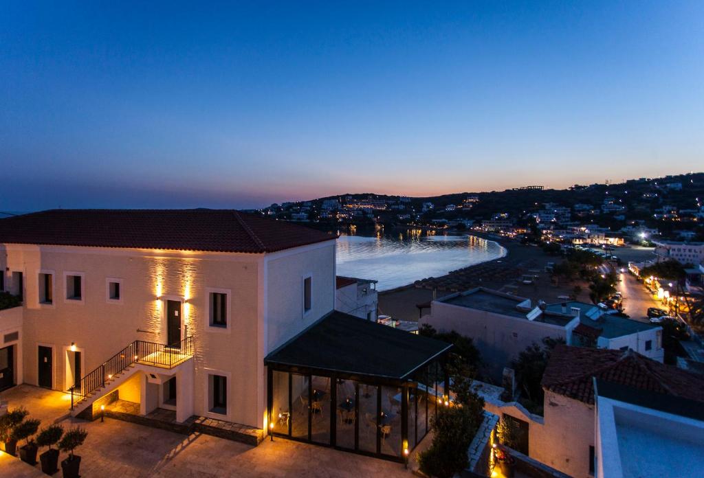 a view of a building at night with a skate park at Krinos Suites Andros in Andros