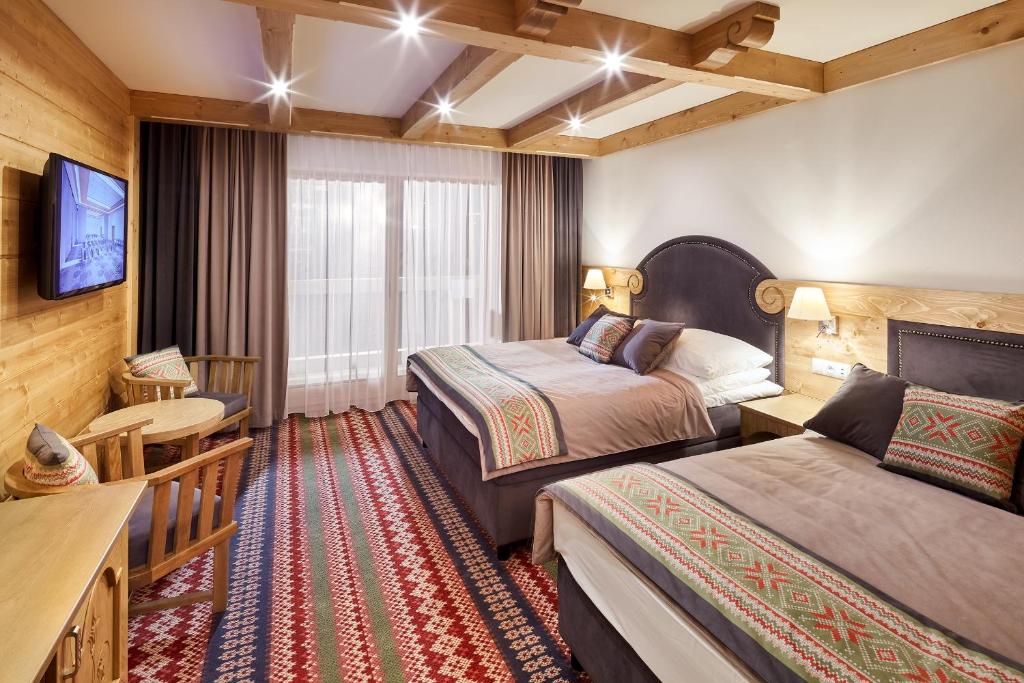 Posteľ alebo postele v izbe v ubytovaní Hotel Bania Thermal & Ski