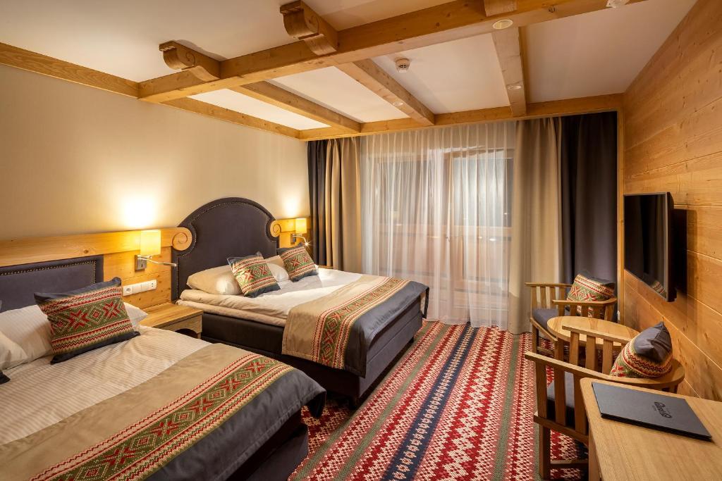 Posteľ alebo postele v izbe v ubytovaní Hotel Bania Thermal & Ski