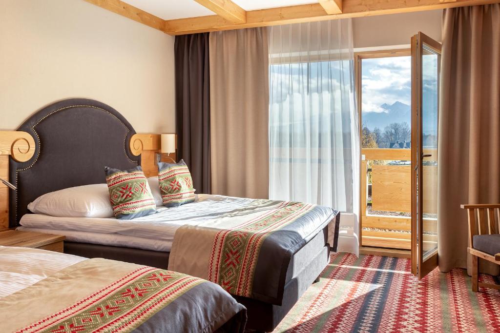 Posteľ alebo postele v izbe v ubytovaní Hotel Bania Thermal & Ski