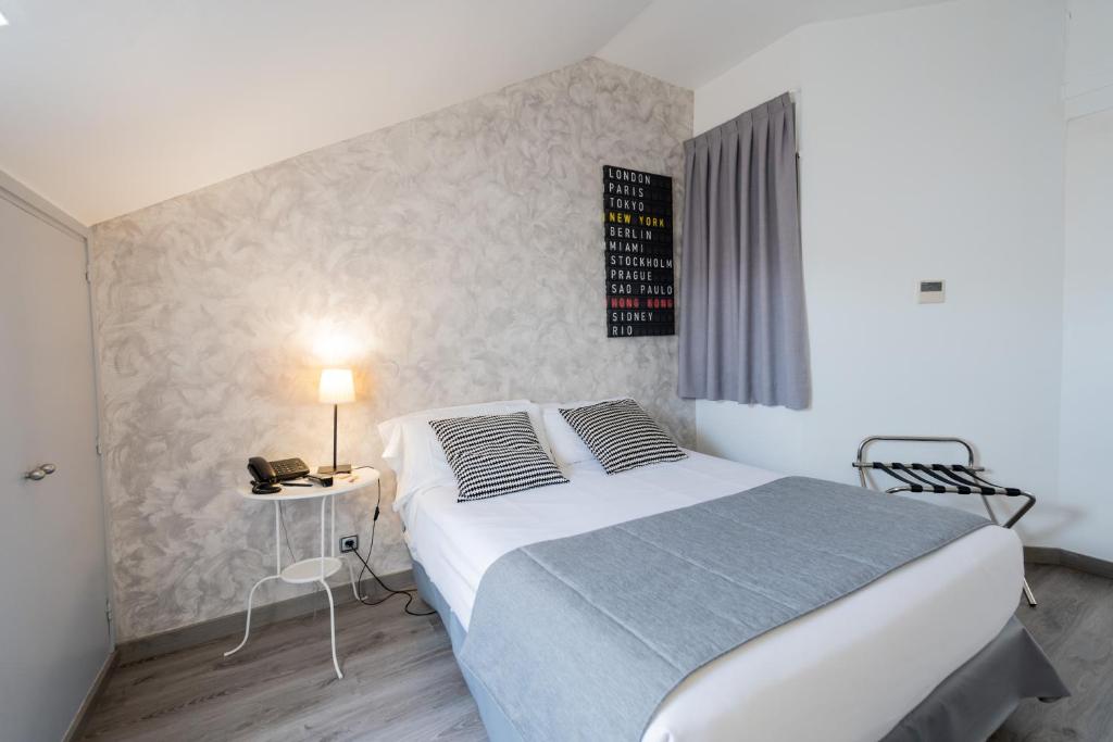 Posteľ alebo postele v izbe v ubytovaní Aparthotel Atenea Calabria