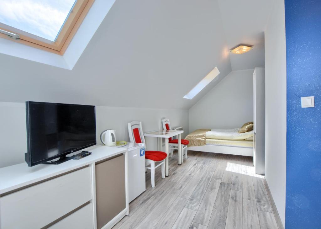 TV a/nebo společenská místnost v ubytování Jaworina- Apartamenty, Domki i Pokoje