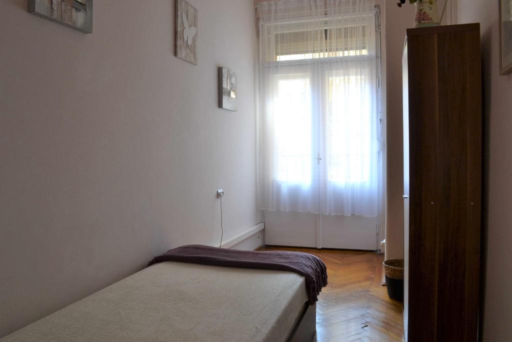 Posteľ alebo postele v izbe v ubytovaní Paprika Apartment Grand