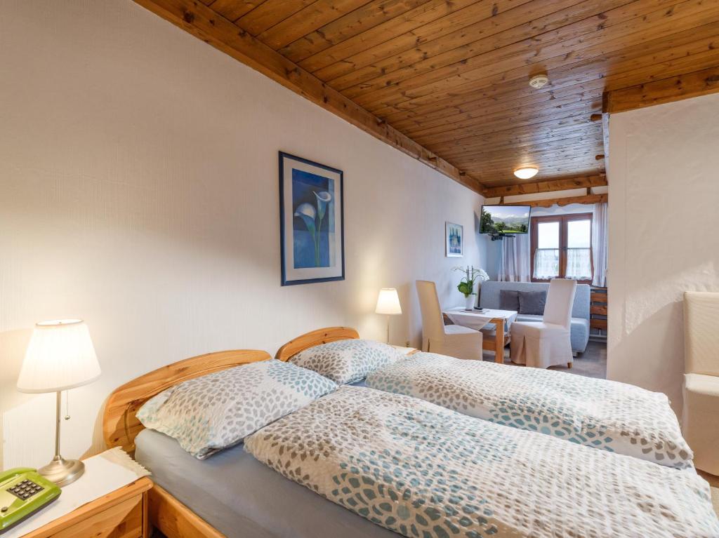 Postel nebo postele na pokoji v ubytování Hotel Baumgarten & Chalet Baumgarten