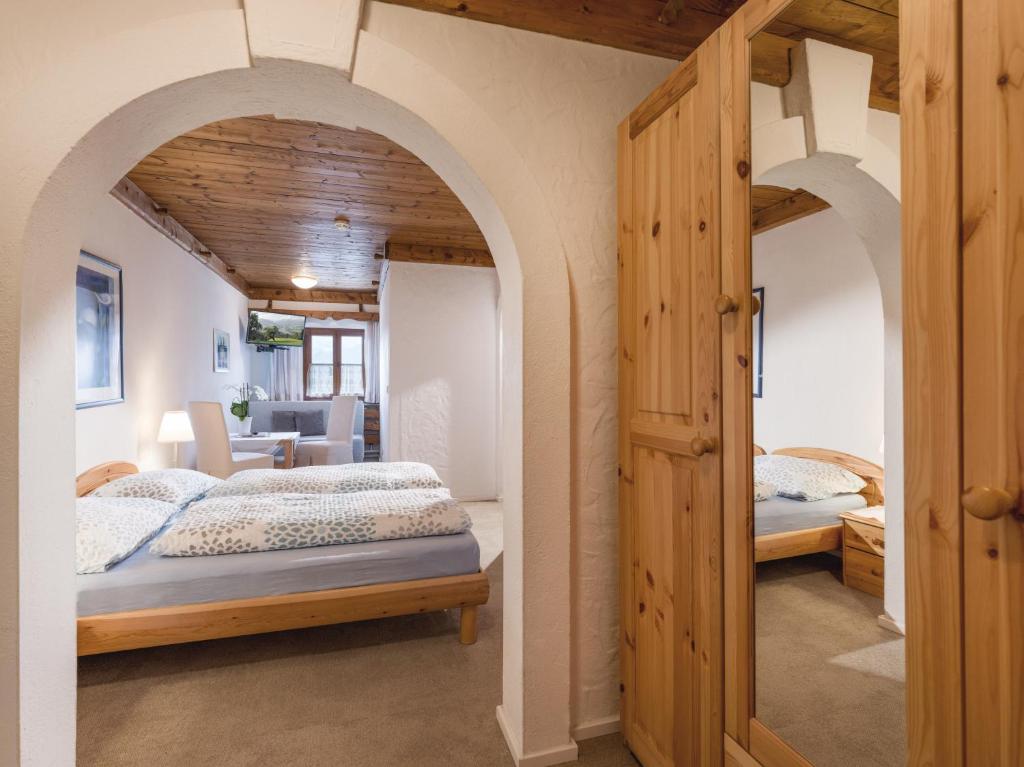 Postel nebo postele na pokoji v ubytování Hotel Baumgarten & Chalet Baumgarten