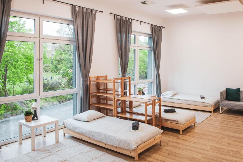 Postel nebo postele na pokoji v ubytování Hostel Montessori