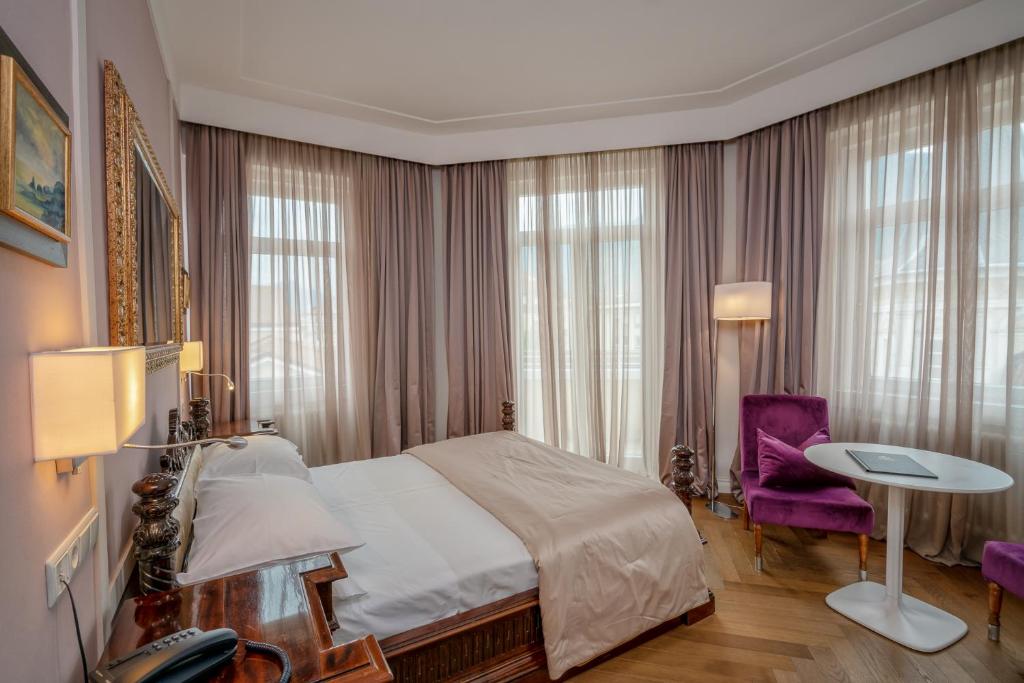 Łóżko lub łóżka w pokoju w obiekcie Hotel Europa Splendid