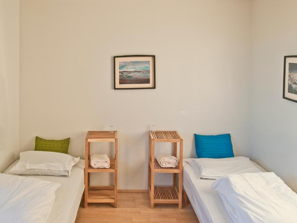 Postel nebo postele na pokoji v ubytování Skyrhusid HI Hostel