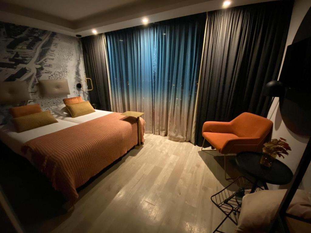 Postel nebo postele na pokoji v ubytování Palace Hotel Zandvoort