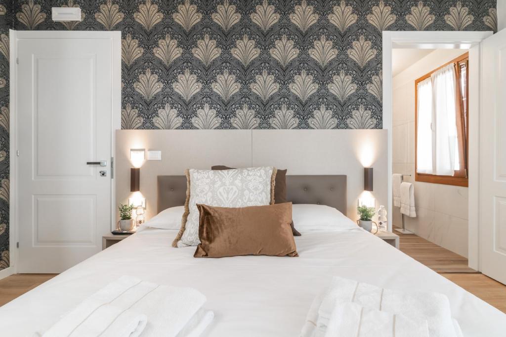 Postel nebo postele na pokoji v ubytování Hotel Grifoni