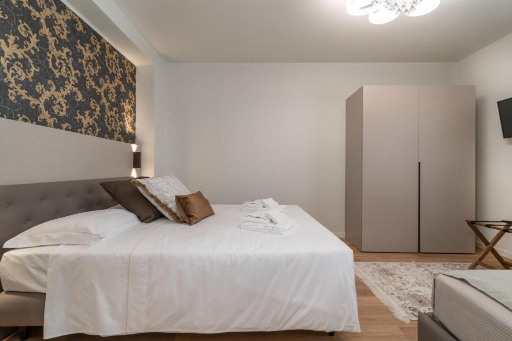 Postel nebo postele na pokoji v ubytování Hotel Grifoni