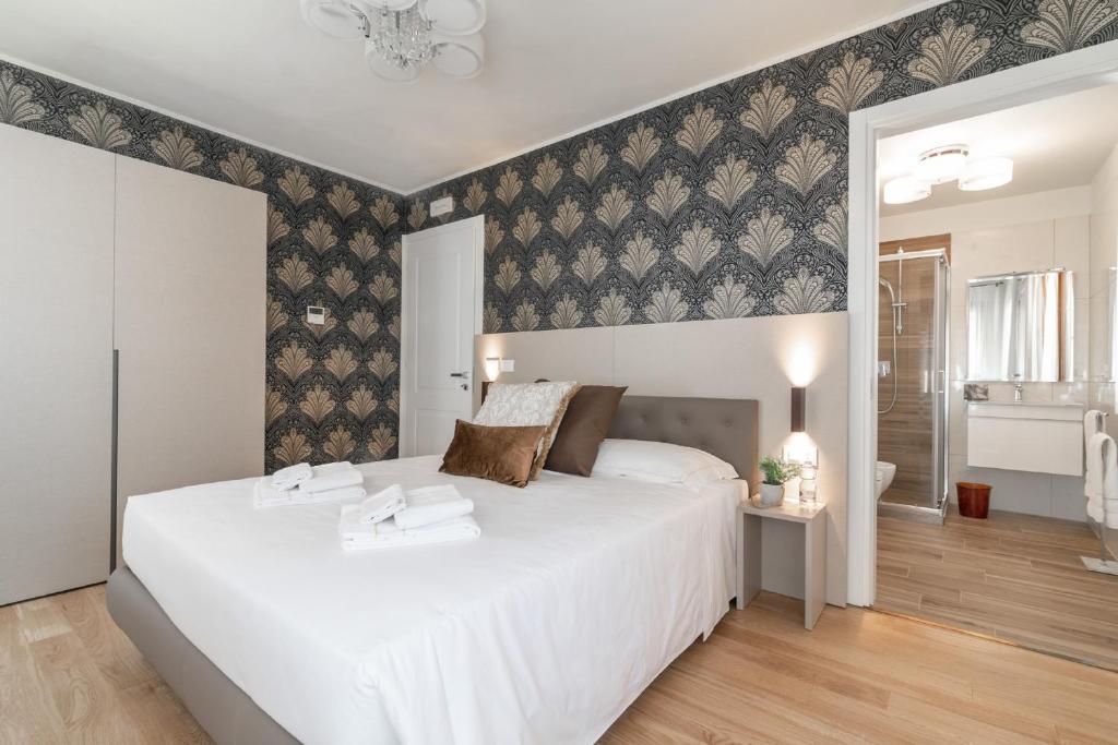 Postel nebo postele na pokoji v ubytování Hotel Grifoni