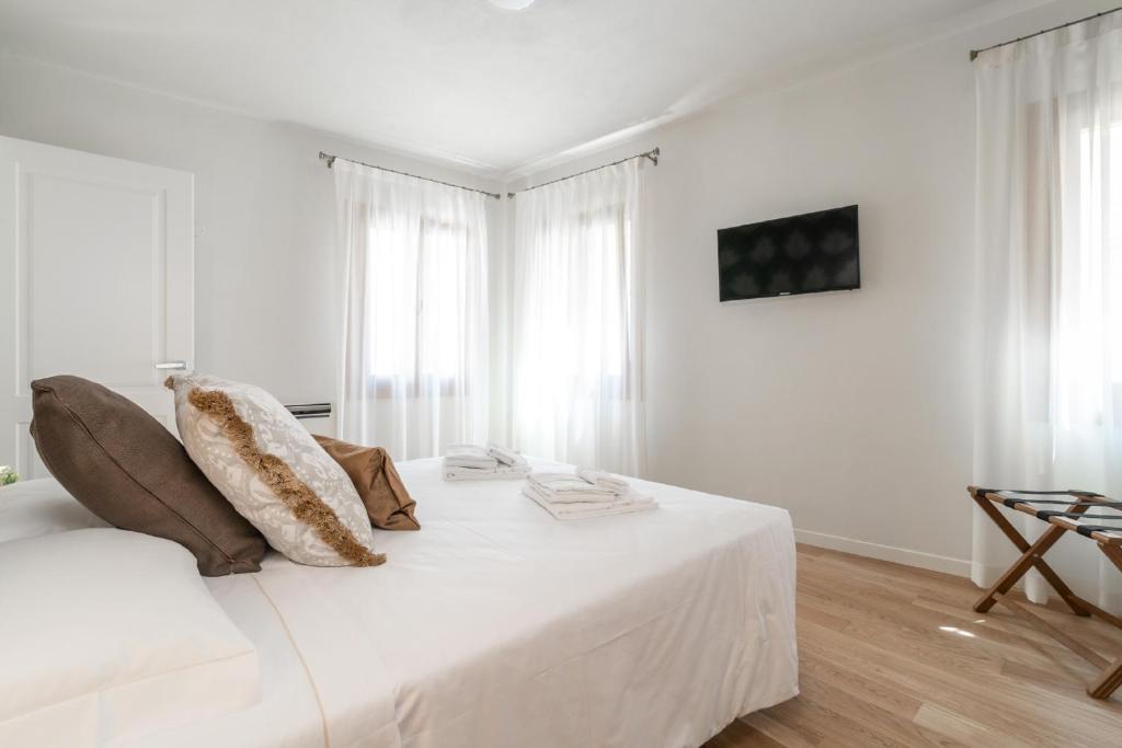 Postel nebo postele na pokoji v ubytování Hotel Grifoni