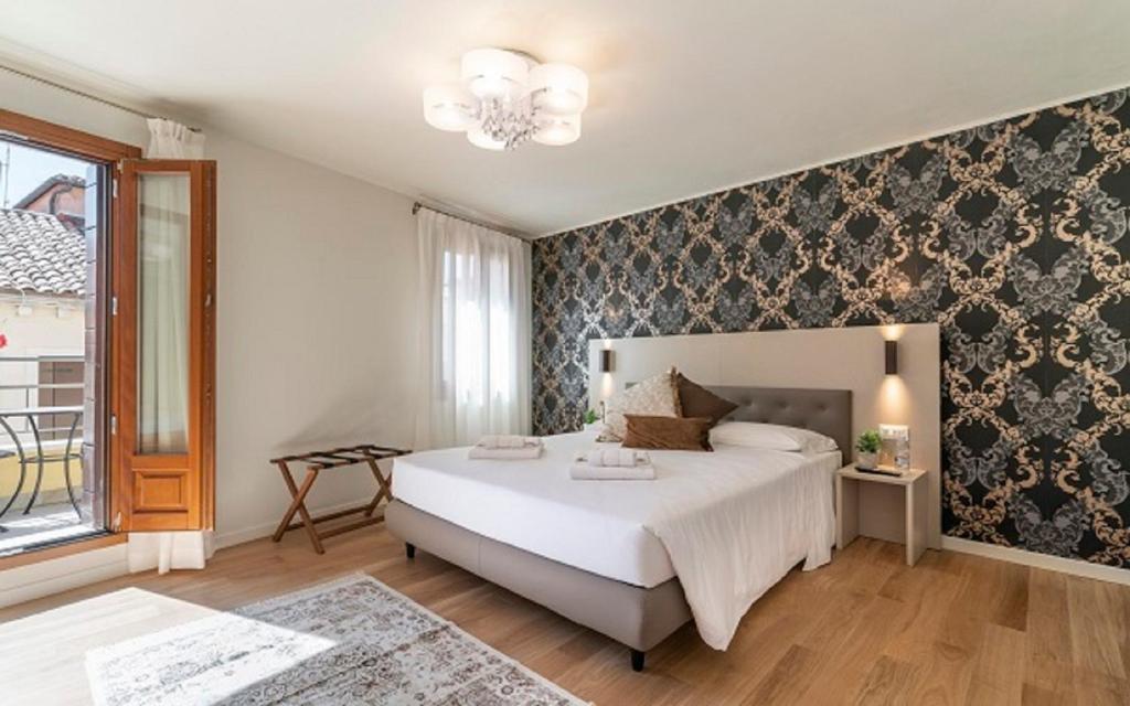 Postel nebo postele na pokoji v ubytování Hotel Grifoni