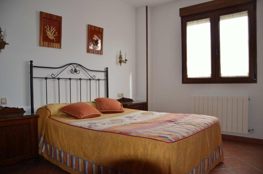 A bed or beds in a room at Refugio La Covatilla I,II,III y IV