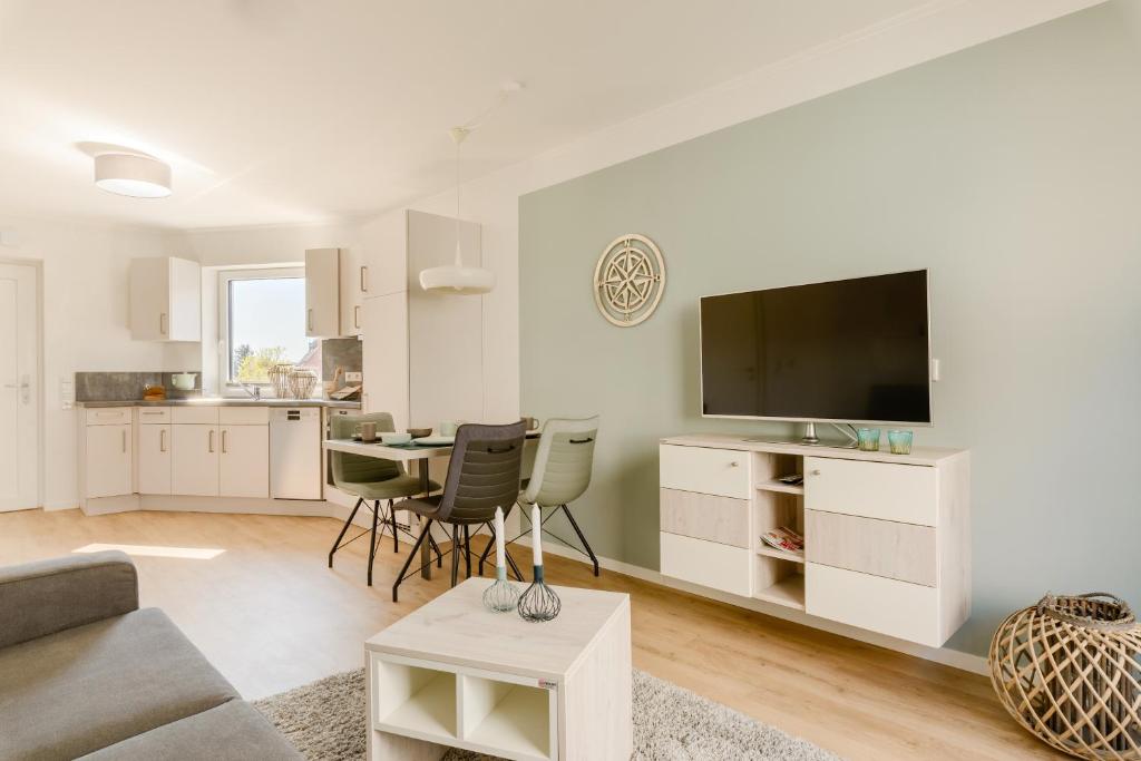 TV a/nebo společenská místnost v ubytování Nordsee-Hotel Hinrichsen
