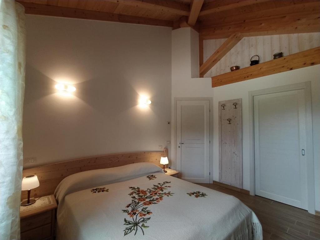 Postel nebo postele na pokoji v ubytování B&B Dolomitincanto