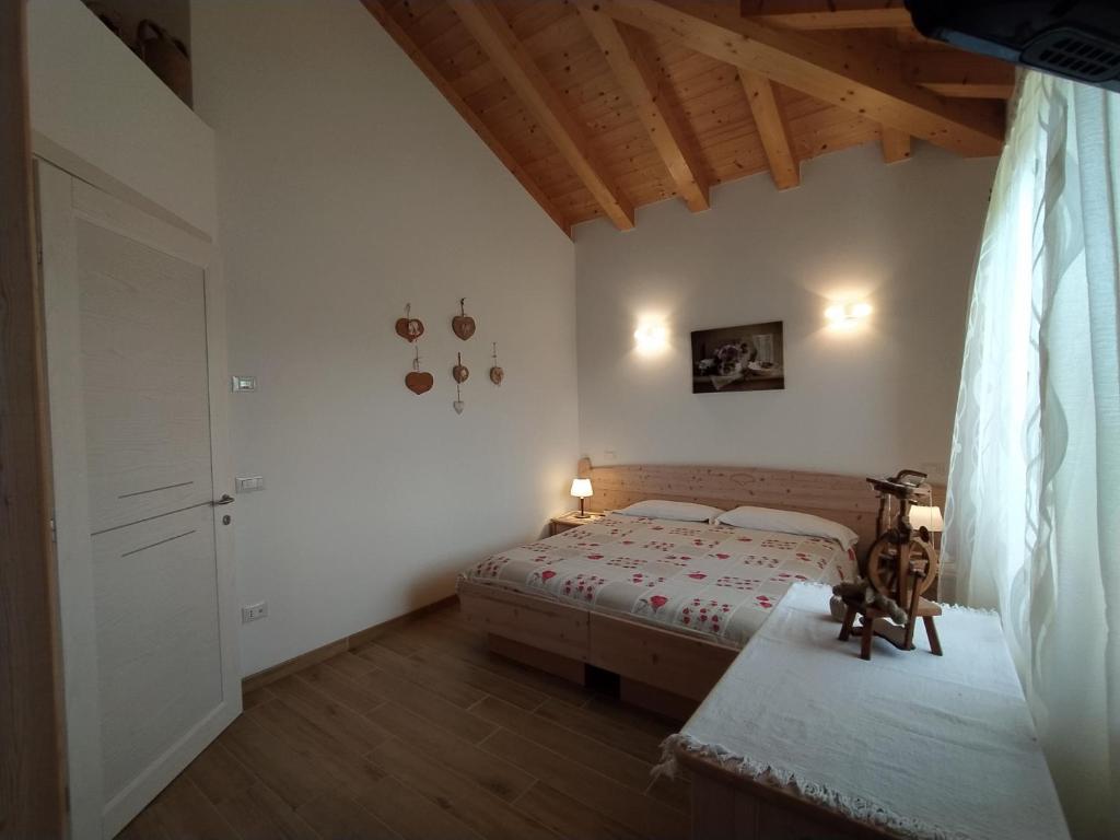 Postel nebo postele na pokoji v ubytování B&B Dolomitincanto