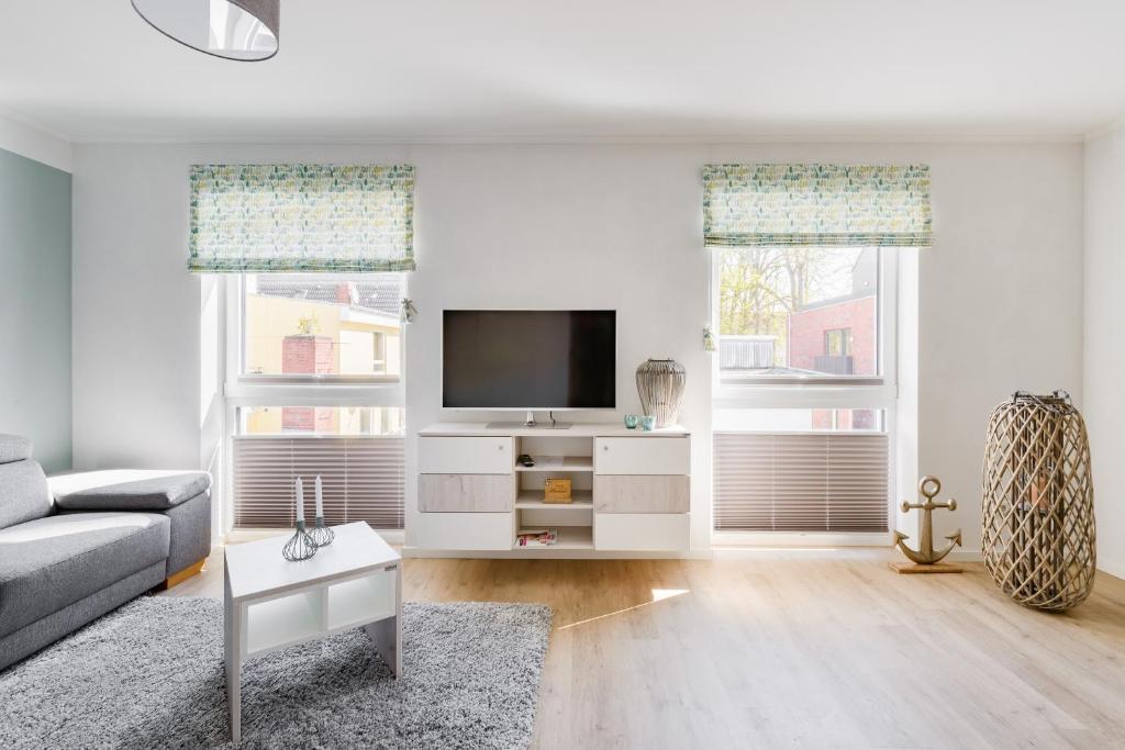 TV a/nebo společenská místnost v ubytování Nordsee-Hotel Hinrichsen